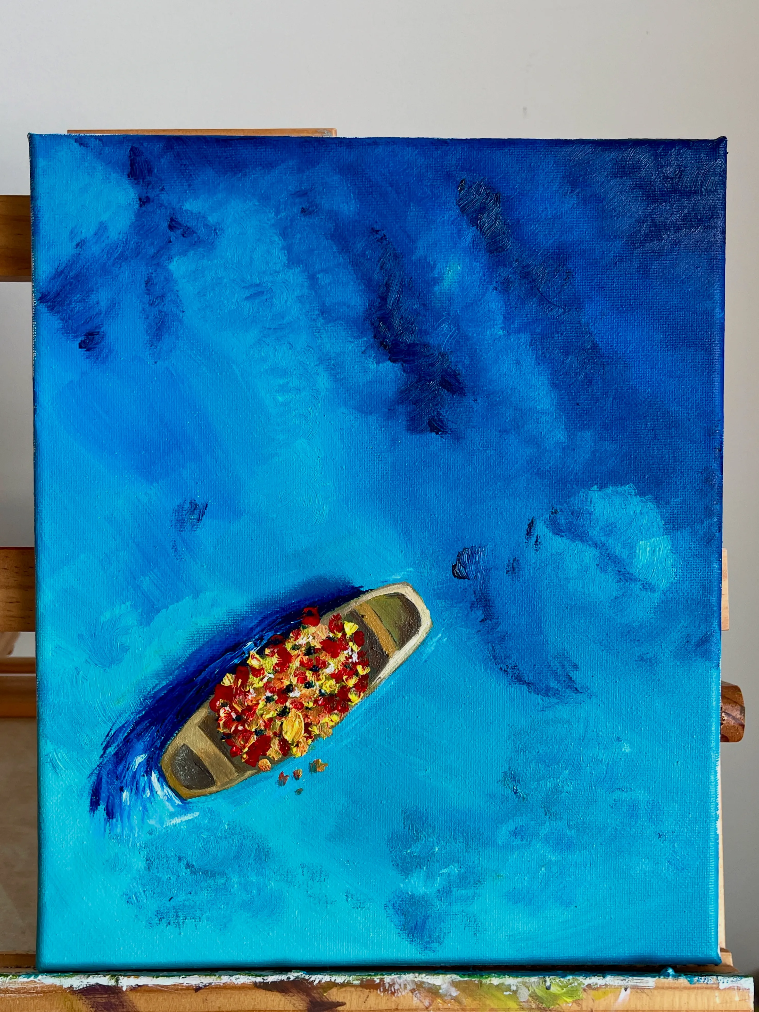 Boat painting by Liz on an easel